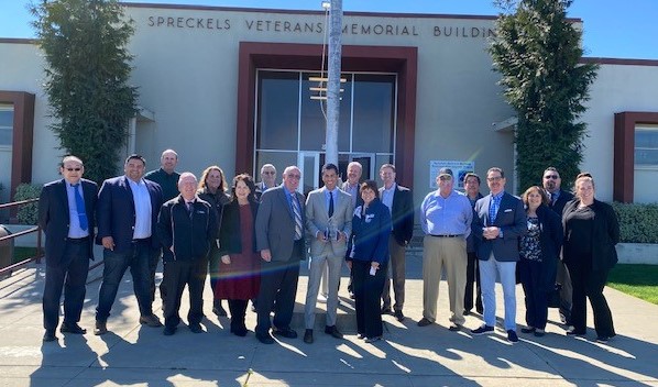 Group photo around Legislator of the Year Asm Rivas